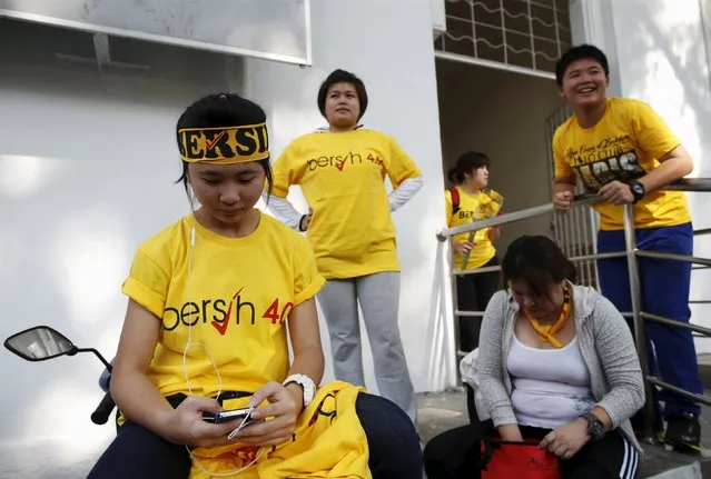 Supporters of pro-democracy group “Bersih” (Clean) gather at the Kuala Lumpur and Selangor Chinese Assembly Hall ahead of their march in Malaysia's capital city of Kuala Lumpur August 29, 2015. (Photo by Edgar Su/Reuters)