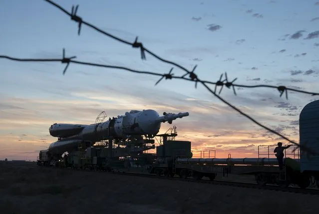 The Soyuz TMA-18M spacecraft is transported from an assembling hangar to its launch pad at the Baikonur cosmodrome, Kazakhstan, August 31, 2015. (Photo by Shamil Zhumatov/Reuters)