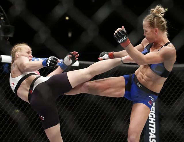 Holly Holm, right, and Valentina Shevchenko trade kicks during a women's bantamweight mixed martial arts bout in Chicago, Saturday, July 23, 2016. (Photo by Nam Y. Huh)/AP Photo