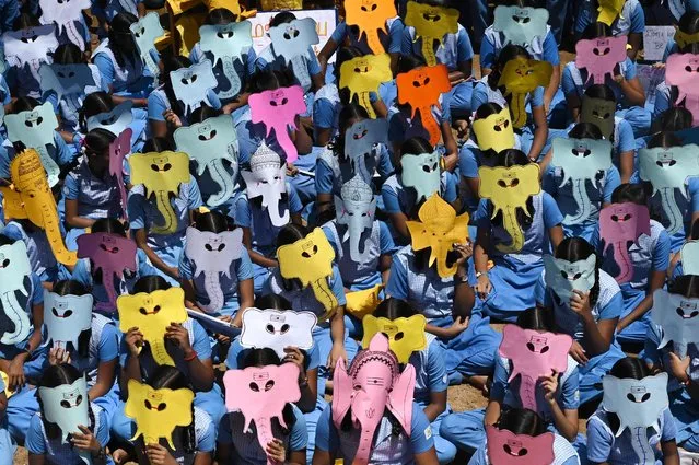 Children wearing masks of the elephant-headed Hindu God Lord Ganesha take part in an awareness campaign against the use of plastic ahead of the “Ganesh Chaturthi” festival, at a school in Chennai on August 30, 2022. (Photo by Arun Sankar/AFP Photo)