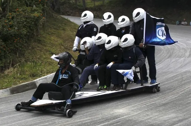 Participants descend a hill on a homemade cart during the 26th Roller Cart Festival in Medellin, Colombia September 6, 2015. (Photo by Fredy Builes/Reuters)