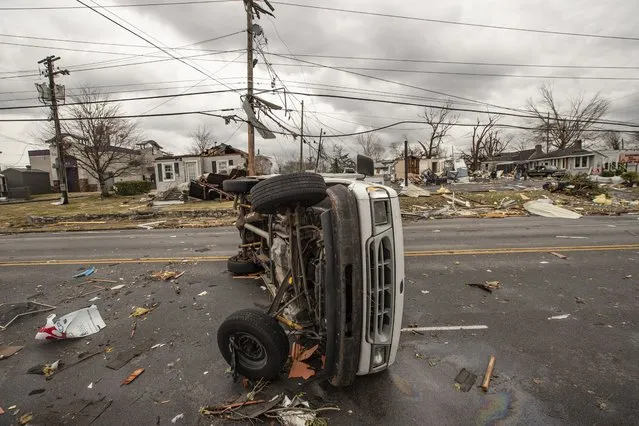 An overturned truck on Broadway Avenue in Bowling Green, Kentucky, on Saturday, December 11, 2021. One or more tornados tore through Bowling Green in the early morning. (Photo by Austin Anthony/The Washington Post)