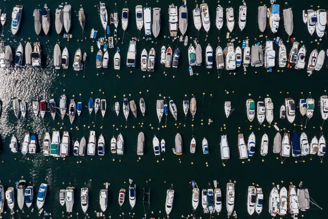 An aerial view shows boats moored in Aberdeen Harbour in Hong Kong on May 19, 2020. (Photo by Anthony Wallace/AFP Photo)