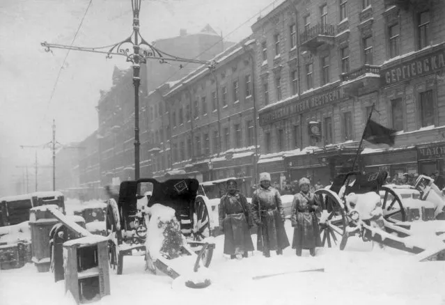 In this photo taken in February 1917, provided by Russian State Archive of Social and Political History, soldiers stand at the barricade in Liteyny Avenue in St.Petersburg, Russia. The 1917 Bolshevik Revolution was long before the digital revolution allowed anyone to instantly document events. But the clumsy cameras of the time still caught some images that capture the period's drama. (Photo by Yakov Steinberg/Russian State Archive of Social and Political History via AP Photo)