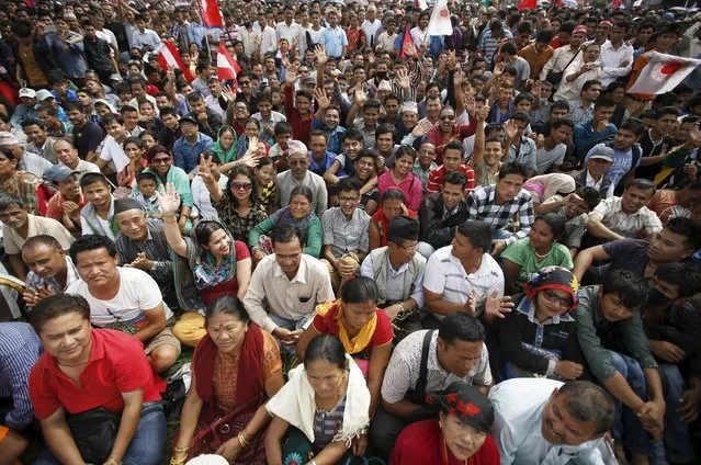 People cheer as they gather during a celebration a day after the first democratic constitution was announced in Kathmandu, Nepal September 21, 2015. (Photo by Navesh Chitrakar/Reuters)