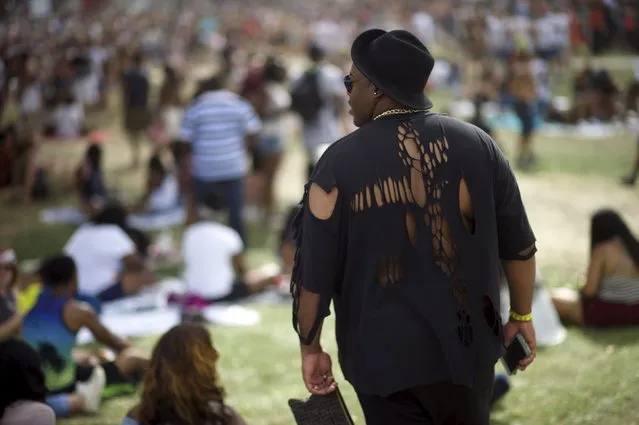 A man listens to the Vic Mensa performance during the fourth annual Made in America Music Festival in Philadelphia, Pennsylvania September 5, 2015. (Photo by Mark Makela/Reuters)
