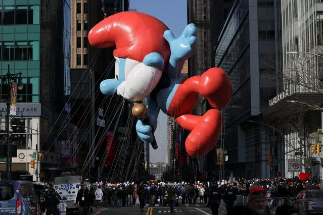 The Smurfs balloon flies during the 96th Macy's Thanksgiving Day Parade in Manhattan, New York City, U.S., November 24, 2022. (Photo by Andrew Kelly/Reuters)