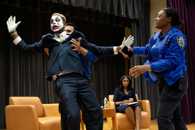 Mayoral hopeful Paperboy Prince is escorted by members of the New York Police Department after storming the stage during a Democratic mayoral forum at Medgar Evers College in New York City, on April 23, 2025. (Photo by David 'Dee' Delgado/Reuters)