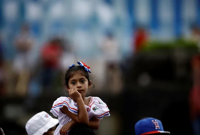 A girl looks a parade to commemorate Costa Rica's Independence Day in San Jose, Costa Rica, September 15, 2016. (Photo by Juan Carlos Ulate/Reuters)