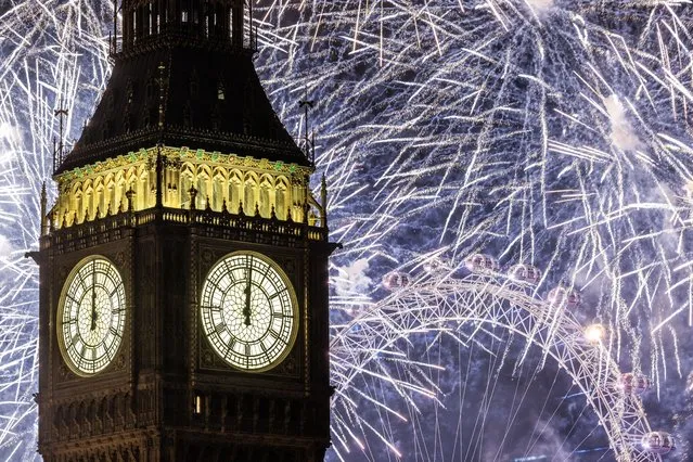 Fireworks light up the London skyline over Big Ben and the London Eye just after midnight on January 1, 2023 in London, England. London's New Years' Eve firework display returned this year after it was cancelled during the Covid Pandemic. (Photo by Dan Kitwood/Getty Images)