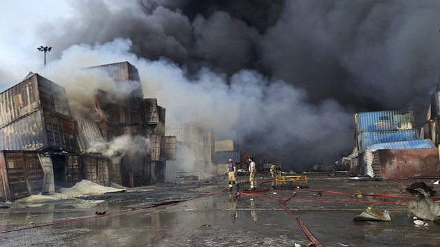 Firefighters work to extinguish the fire, Sunday, April 27, 2025, after a massive explosion and fire rocked a port near the southern port city of Bandar Abbas, Iran on Saturday. (Phoot by Meysam Mirzadeh/Tasnim News via AP Photo)