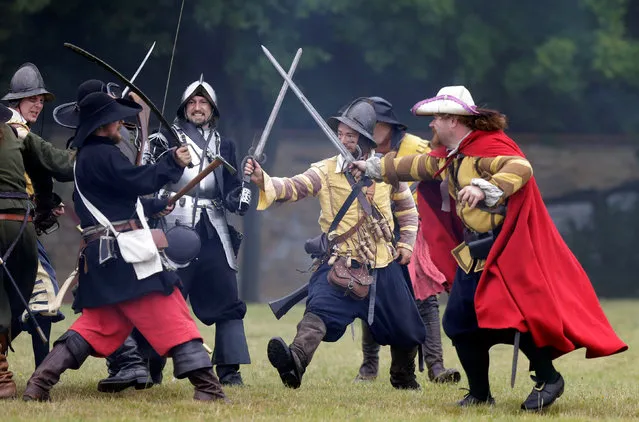 Participants wearing medieval costumes re-enact the 1620 battle of Bila Hora between Bohemian Estates and Austrian Imperial with Catholic forces in Prague, Czech Republic September 18, 2016. (Photo by David W. Cerny/Reuters)