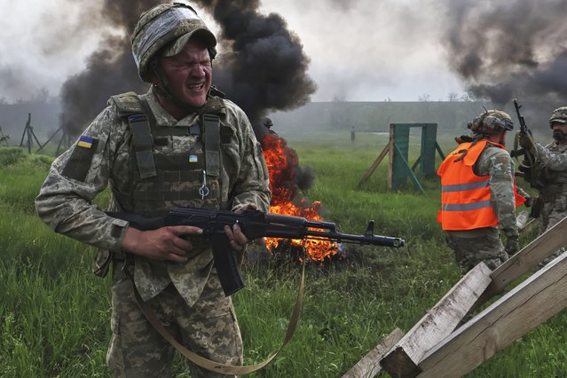 In this photo provided by Ukraine's 65th Mechanized Brigade press service, Ukrainian servicemen attend a military training in Zaporizhzhia region, Ukraine, Monday, May 26, 2025. (Photo by Andriy Andriyenko/Ukraine's 65th Mechanized Brigade via AP Photo)