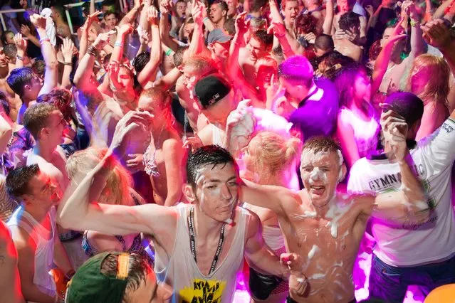 A combined British tour operator crowd, including Escapades and Club 18-30, on the dance floor during a foam party at the Club Ice, Ayia Napa, Cyprus on June 7, 2013. (Photo by Peter Dench/Getty Images Reportage)