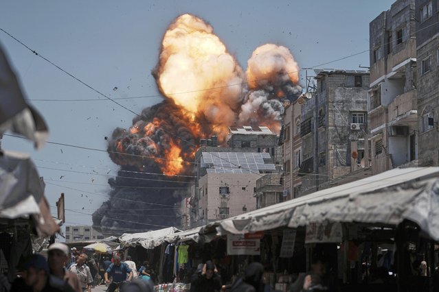 Thick smoke and flames erupt from an Israeli airstrike in Gaza City, Sunday, June 1, 2025. (Photo by Jehad Alshrafi/AP Photo)