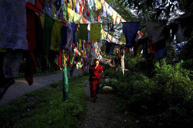 A Tibetan monk circumambulates clockwise around Tsuglagkhang, also known as Dalai Lama's Temple complex, in the northern hill town of Dharamshala, India, on July 1, 2025. (Photo by Anushree Fadnavis/Reuters)