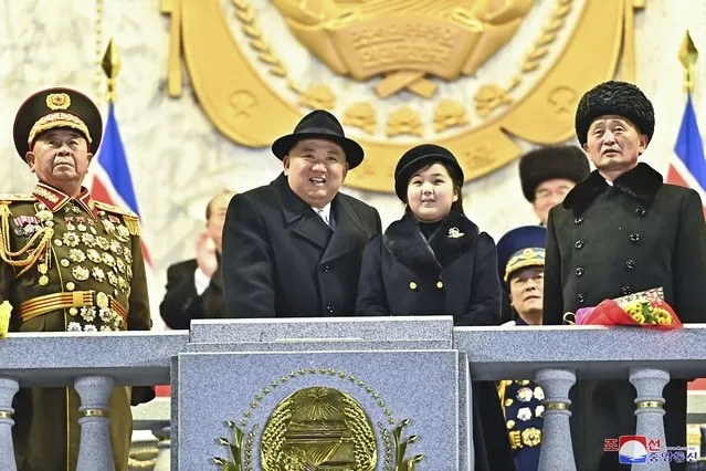 In this photo provided by the North Korean government, North Korean leader Kim Jong Un, center left, with his daughter attends a military parade to mark the 75th founding anniversary of the Korean People’s Army on Kim Il Sung Square in Pyongyang, North Korea Wednesday, February 8, 2023. Independent journalists were not given access to cover the event depicted in this image distributed by the North Korean government. The content of this image is as provided and cannot be independently verified. Korean language watermark on image as provided by source reads: “KCNA” which is the abbreviation for Korean Central News Agency. (Photo by Korean Central News Agency/Korea News Service via AP Photo)