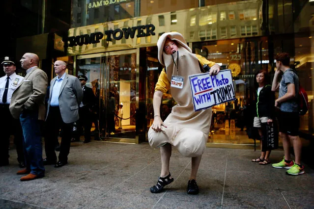 A man in a pen*s costume stands outside Trump Tower where Republican presidential nominee Donald Trump lives in the Manhattan borough of New York, U.S., October 8, 2016. (Photo by Eduardo Munoz/Reuters)