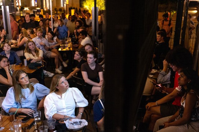 People watch the CNN presidential debate from Union Pub in Washington, DC, on Thursday, June 27, 2024. (Photo by Tristen Rouse/CNN)