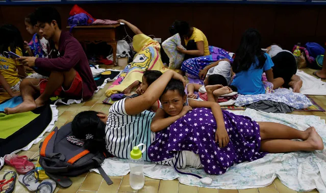 Residents who evacuated their homes due to Typhoon Haima take shelter at an evacuation centre in San Fernando, la Union in northern Philippines, October 19, 2016. (Photo by Erik De Castro/Reuters)