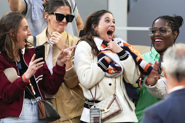 A happy tennis fan caught Serbia's Novak Djokovic's towel after his fourth round match of the French Open tennis tournament against Argentina's Francisco Cerundolo at the Roland Garros stadium in Paris, Monday, June 3, 2024. (Photo by Thibault Camus/AP Photo)