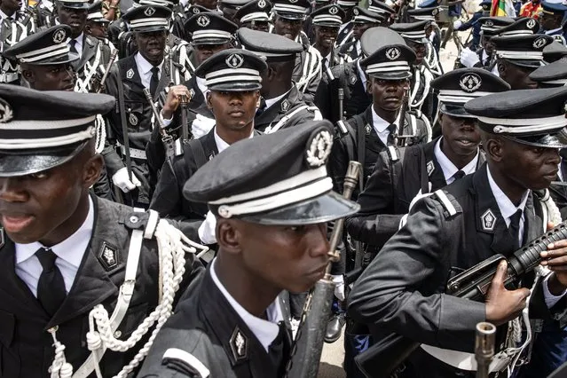 Officers of the Senegalese Armed Forces get themselves ready to take part in celebrations for Senegal's 63rd Independence Day in Dakar on April 04, 2023. (Photo by John Wessels/AFP Photo)