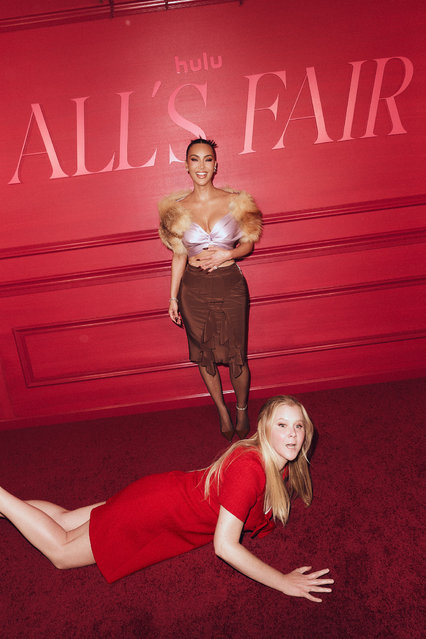 American media personality Kim Kardashian and American comedian Amy Schumer recreate their viral red carpet moment at the “All’s Fair” at The Whitby Hotel in New York City on Tuesday, October 28. (Disney/Jonny Marlow)