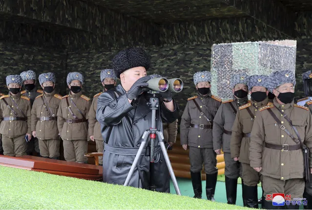 In this Friday, February 28, 2020, file photo provided on Feb. 29, 2020 by the North Korean government, North Korean leader Kim Jong Un, center, inspects the military drill of units of the Korean People's Army, with soldiers shown wearing face masks. South Korea’s military says North Korea has fired at least one unidentified projectile. The launch on Monday, March 2, 2020 came two days North Korea’s state media said leader Kim supervised an artillery drill aimed at testing the combat readiness of units in front-line and eastern areas. Independent journalists were not given access to cover the event depicted in this image distributed by the North Korean government. The content of this image is as provided and cannot be independently verified. Korean language watermark on image as provided by source reads: “KCNA” which is the abbreviation for Korean Central News Agency. (Photo by Korean Central News Agency/Korea News Service via AP Photo/File)