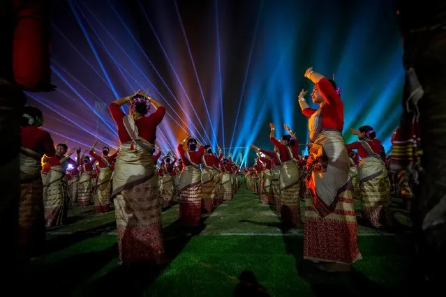 Assamese dancers in traditional attire perform as they attempt Guinness World Record in the largest folk dance performance category in Guwahati, India, Friday, April 14, 2023. (Photo by Anupam Nath/AP Photo)
