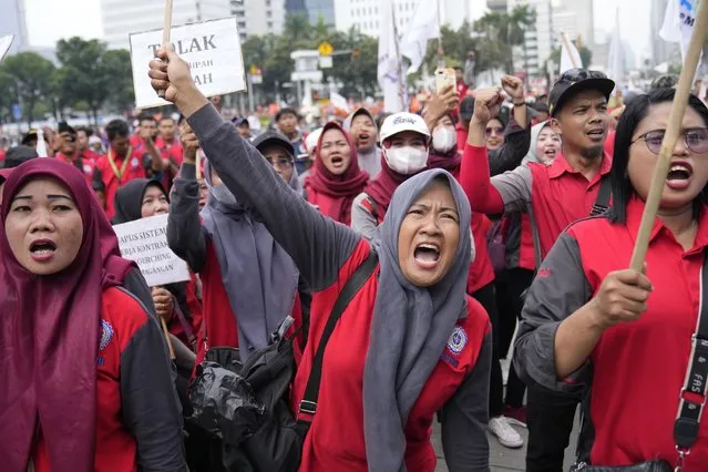 Workers shout slogans during a May Day rally in Jakarta, Indonesia, Monday, May 1, 2023. Workers and activists across Asia are marking May Day with protests calling for higher salaries and better working conditions, among other demands. (Photo by Dita Alangkara/AP Photo)