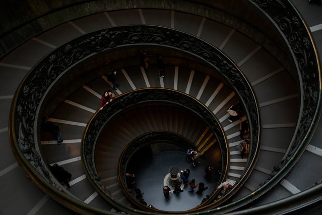 Tourists stroll on the Bramante staircase at the Vatican Museums as a new photovoltaic glass roof at the entrance was inaugurated at the Vatican, Friday, December 20, 2024. (Photo by Gregorio Borgia/AP Photo)