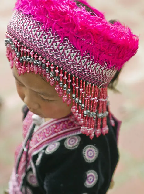 “Her Name is Flower”. Flower is a girl from the Hill Tribes of northern Thailand who, wearing her native costume, comes to Doi Suthep temple, just above Chiang Mai, Thailand, to greet visitors. (Photo and caption by Ileana Oroza/National Geographic Traveler Photo Contest)