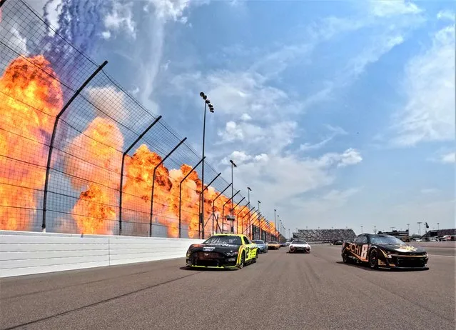 Pyrotechnics go off as Kyle Busch, driver of the #8 3CHI Chevrolet, and Ryan Blaney, driver of the #12 Menards/Richmond Water Heaters Ford, lead the field on a pace lap prior to the NASCAR Cup Series Enjoy Illinois 300 at WWT Raceway on June 04, 2023 in Madison, Illinois. (Photo by Jonathan Bachman/Getty Images)