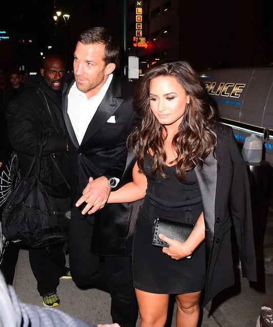 A smiling Demi Lovato and UFC fighter Luke Rockhold confirmed their rumored relationship as they held hands while arriving to UFC 205 at Madison Square Garden in NYC on November 12, 2016. The couple teased fans with matching pinky tattoos on instagram earlier in the summer, but they finally confirmed their romance with this first display of public affection. (Photo by 247PAPS.TV/Splash News)