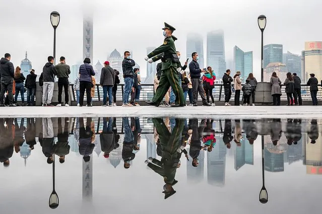 Two paramilitary policemen patrol on the sightseeing platform on the Bund in Shanghai, China Friday, March 19, 2021. (Photo credit should read Feature China/Barcroft Media via Getty Images)