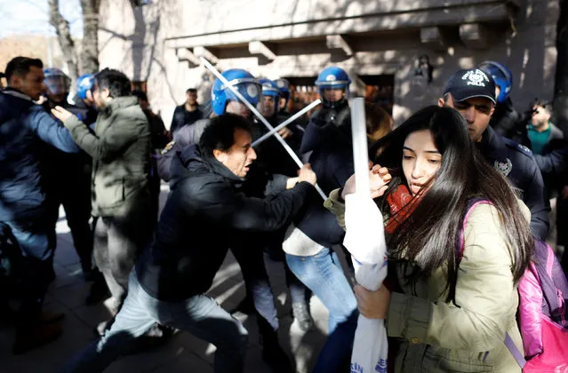 Riot police scuffle with protesters trying to march to the Turkish Parliament to protest against a proposal that would have allowed sentencing in cases of sexual abuse committed “without force, threat or trick” before Nov. 16, 2016 to be indefinitely postponed if the perpetrator marries the victim, in Ankara, Turkey, November 22, 2016. (Photo by Umit Bektas/Reuters)