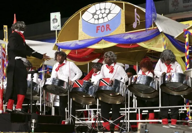 Members of the T&TEC Tropical Angel harps steelband play “Pan For Beethoven” in the large band category during the National Panorama finals held by the governing body Pan Trinbago at the Queen's Park Savannah in Port-of-Spain February 15, 2015. (Photo by Andrea De Silva/Reuters)