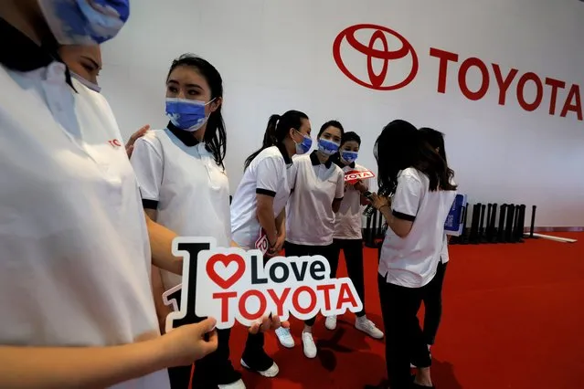 Promoters for Toyota prepare for duty during the Shanghai Auto Show in Shanghai on Monday, April 19, 2021. (Photo by Ng Han Guan/AP Photo)