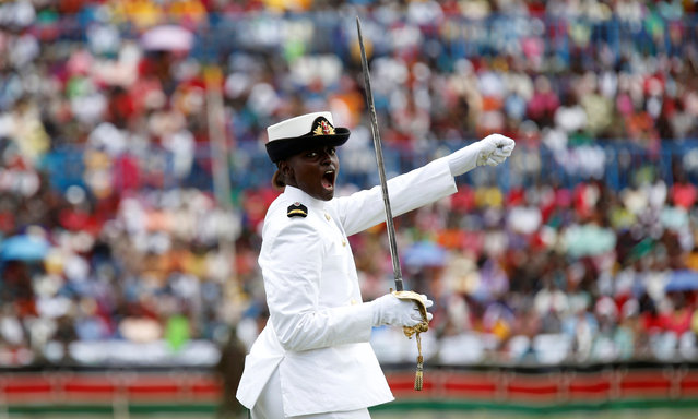 Captain Alice Ngure of the Kenya Navy shouts to instruct her troops as they march in a parade during the national celebration to mark Kenya's Jamhuri Day (Independence Day) at the Nyayo Stadium in Nairobi December 12, 2016. (Photo by Thomas Mukoya/Reuters)