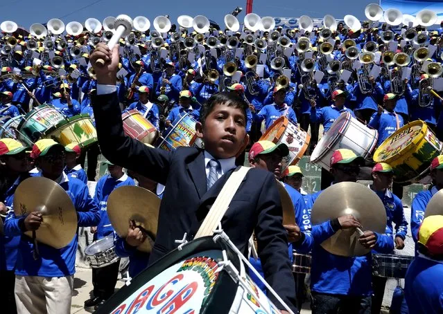 Youth musicians perform in the annual brass band festival to kick off pre-Carnival festivities in Oruro, Bolivia, January 30, 2016. (Photo by David Mercado/Reuters)