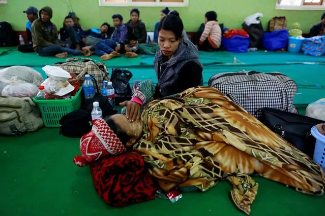Refugees who fled from violence in Laukkai, Kokang region, pass time at a temporary refugee camp set up in a monastery in Lashio February 19, 2015. (Photo by Soe Zeya Tun/Reuters)