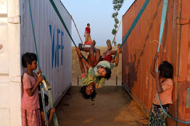 Rohingya refugee children play with a swing at Balukhali camp in Cox’s Bazar, Bangladesh, November 16, 2018. (Photo by Mohammad Ponir Hossain/Reuters)