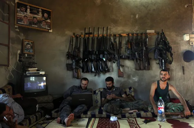 “Free Syrian Army” fighters sit in a house on the outskirts of Aleppo, Syria, Tuesday, June 12, 2012. (Photo by AP Photo)