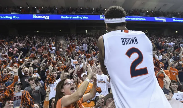 Auburn guard Bryce Brown (2) celebrates the Tigers' 84-80 win over Tennessee with fans after an NCAA college basketball game Saturday, March 9, 2019, in Auburn, Ala. (Photo by Julie Bennett/AP Photo)