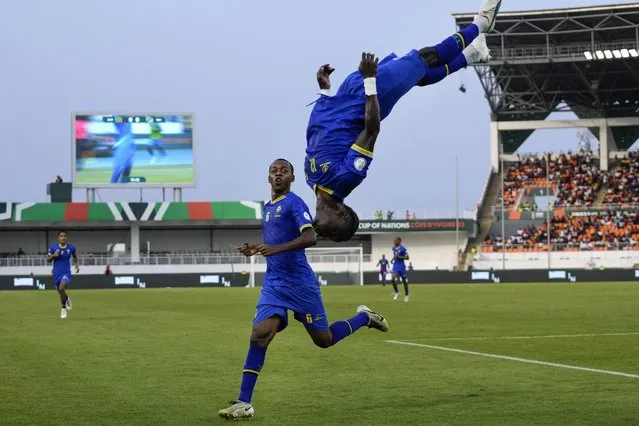 Tanzania's scorer Simon Msuva, right, jumps a somersault after he scored the opening goal during the African Cup of Nations Group F soccer match between Zambia and Tanzania, at the Laurent Pokou stadium in San Pedro, Ivory Coast, Sunday, January 21, 2024. (Photo by Themba Hadebe/AP Photo)