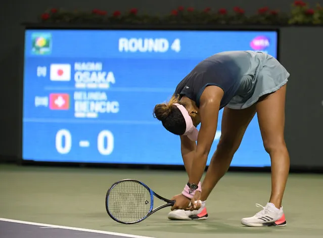 Naomi Osaka, of Japan, reacts after losing a point to Belinda Bencic, of Switzerland, at the BNP Paribas Open tennis tournament Tuesday, March 12, 2019 in Indian Wells, Calif. (Photo by Mark J. Terrill/AP Photo)