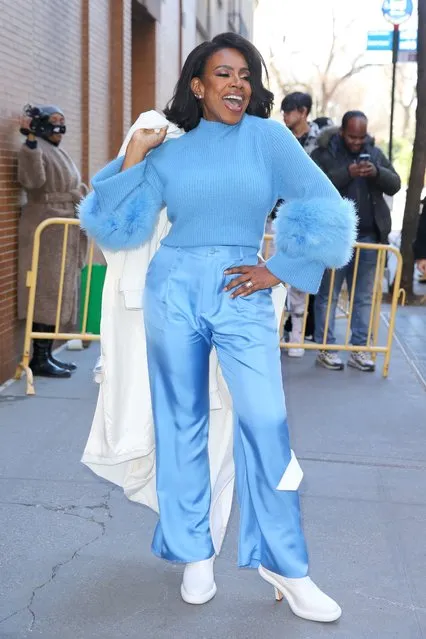 “Abbott Elementary” star Sheryl Lee Ralph dances in blue silk pants, blue ribbed sweater with fluffy sleeves, white platform boots and a white coat outside The View in New York City on February 7, 2024. (Photo by Christopher Peterson/Splash News and Pictures)