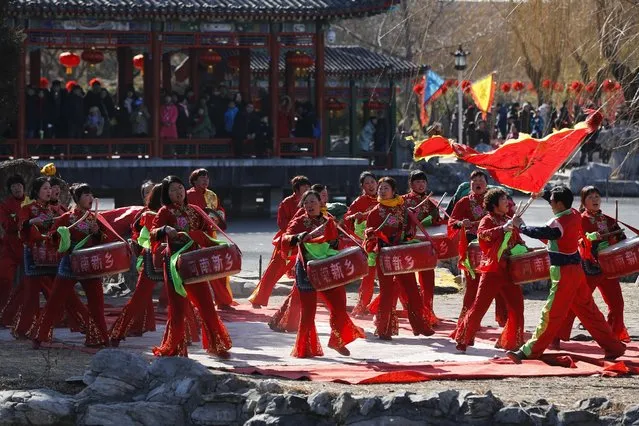 Chinese performers dressed in traditional costumes participate in a cultural dance at the Daguanyuan's temple fair for Lunar New Year celebrations in Beijing, Wednesday, February 1, 2017. Residents are enjoying a week long holiday for the Chinese New Year and visiting various temple fairs and carnivals around the Chinese capital. (Photo by Andy Wong/AP Photo)