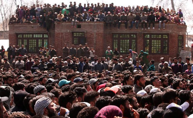 People attend the funeral of Taweef Ahmad, a suspected militant, who according to local media reports was killed during a gun battle with Indian security forces today, in Gadbugh village in South Kashmir's Pulwama district April 1, 2019. (Photo by Danish Ismail/Reuters)
