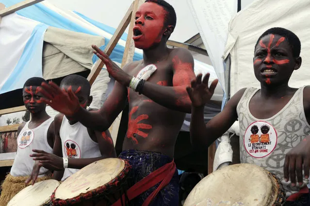 In this photo taken on Friday, February 10, 2017, performers play music next to a festival tent at the Amani Festival held in Goma, Democratic Republic of Congo. Nearly 36,000 people have gathered in Goma for a three-day festival of music and dance aimed at promoting peace and boosting the global image of eastern Congo. (Photo by Al-hadji Kudra Maliro/AP Photo)